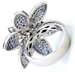 18Kt White Gold Flower Ring with 1.71 kt Ruby, Sapphires and Diamonds.
