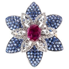 18Kt White Gold Flower Ring with 1.71 kt Ruby, Sapphires and Diamonds.