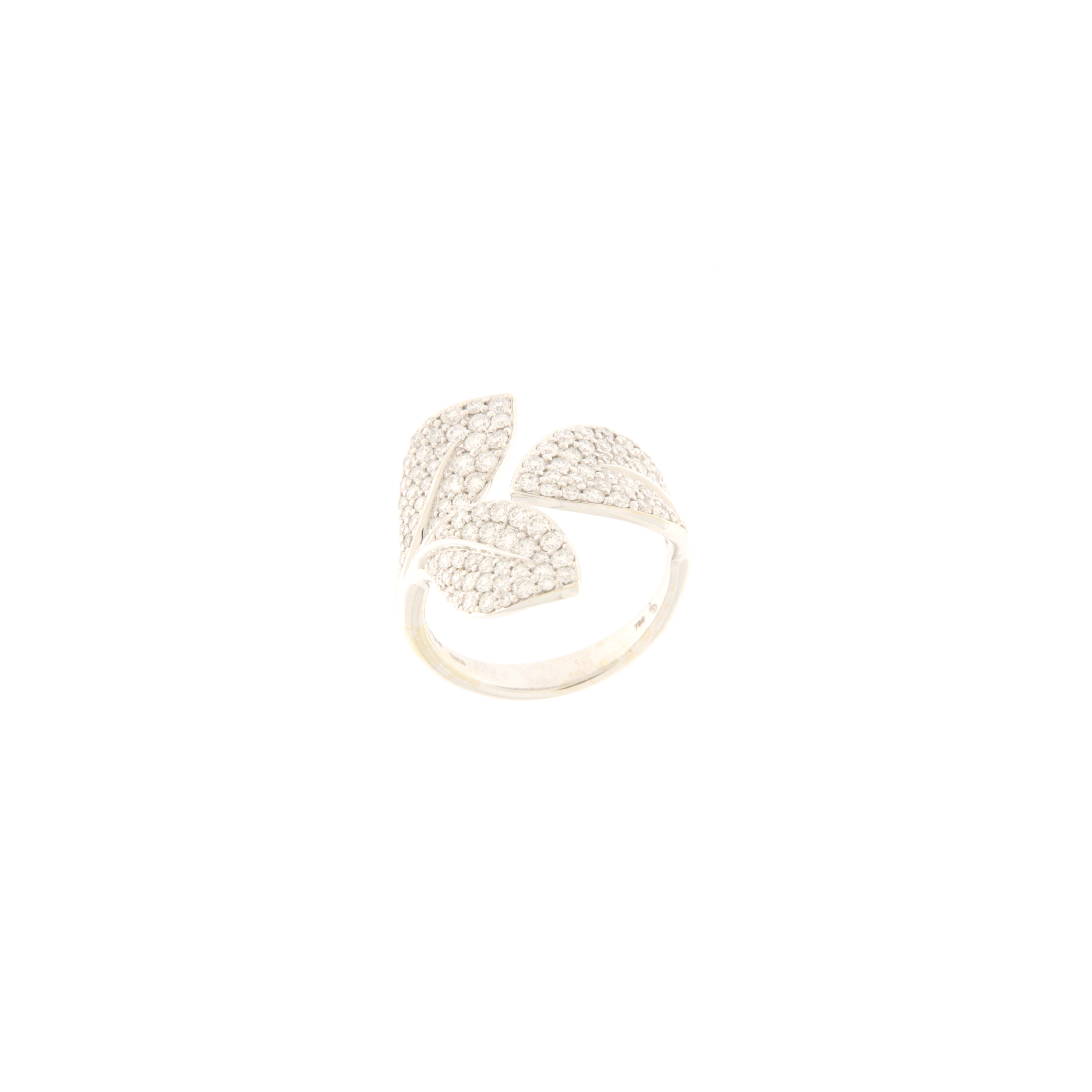18K white gold ring with design of three leaves creating an embrace in the central part. The ring stays flat on the finger, allowing for very comfortable wearing. The leaves are fully embellished with ct. 1.37 diamonds.