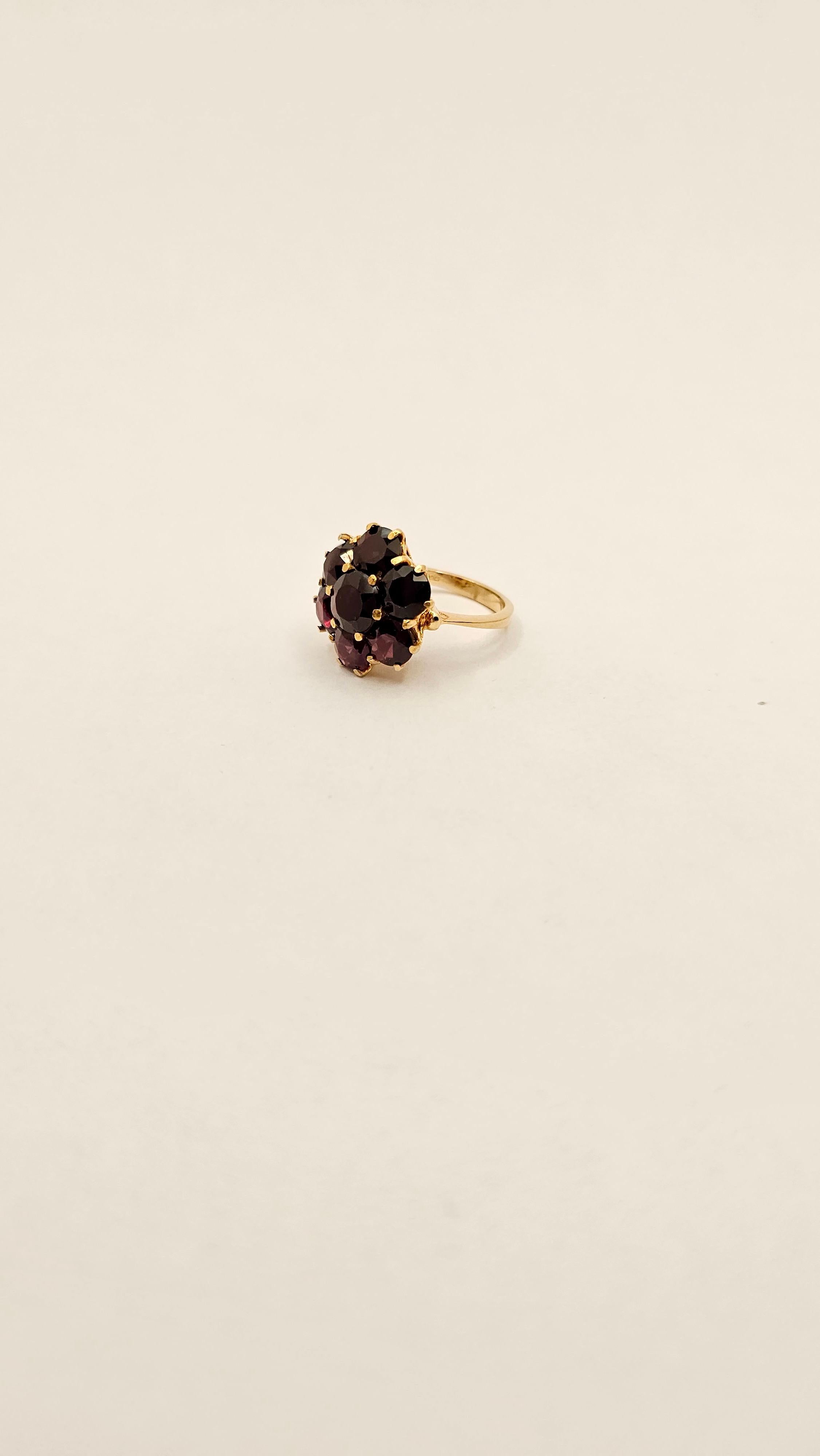 A 1950s Italian-made ring with a design typical of its era.
This ring is new, never worn.
The workmanship is meticulous in every detail, the part underneath the stones and pierced by hand creating a delightful pattern.
The gold's 750 title is marked