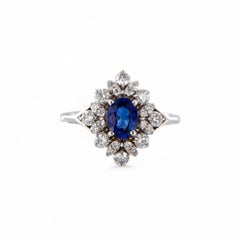 Handcrafted 18kt White Gold Ring with Oval Sapphire and Diamonds