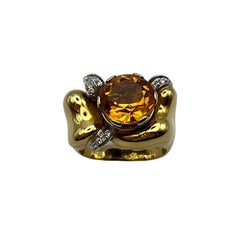 Anello artigianale in oro giallo 18 kt. 750/00 con topazio 5.70 ct. e brillanti