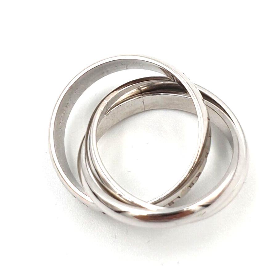 Anello Cartier Or, Amor et Trinity in oro bianco For Sale 1