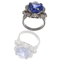 Ring with a 12.20-carat blue sapphire (UNHEATED), IGI-certified, and diamonds