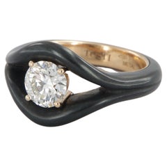 Contemporary iron and gold ring with 1, 25 carat diamond GIA certified