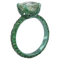 Contemporary titanium ring with tsavorites and 3, 61-carat green tourmaline
