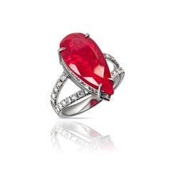 Handcrafted 18-karat white gold ring with a vivid ruby and pavé diamonds