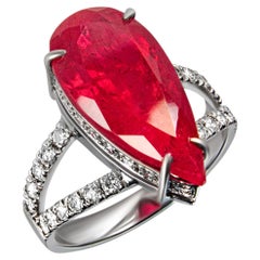 Handcrafted 18-karat white gold ring with a vivid ruby and pavé diamonds