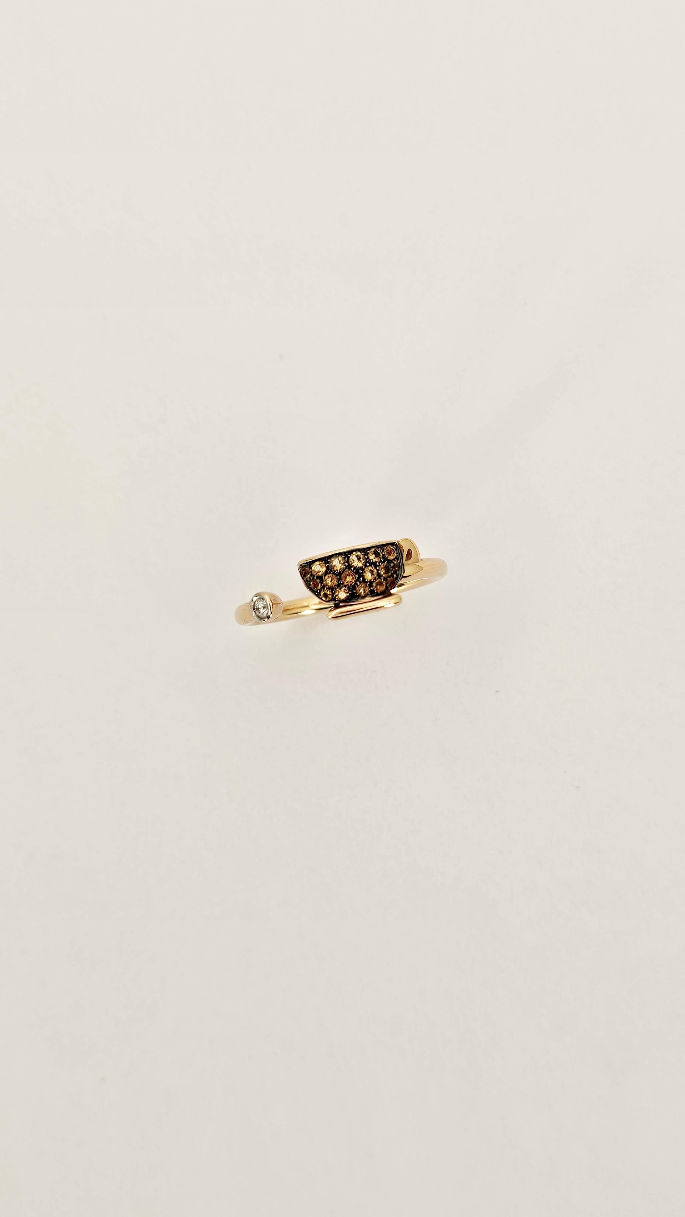 An imaginative ring with a playful and romantic style created by Italian designer Francesca Villa. 
Made of 18kt rose gold and embellished with an orange Topaz pave and a Diamond.
This piece of jewelry is polished in every detail, from the