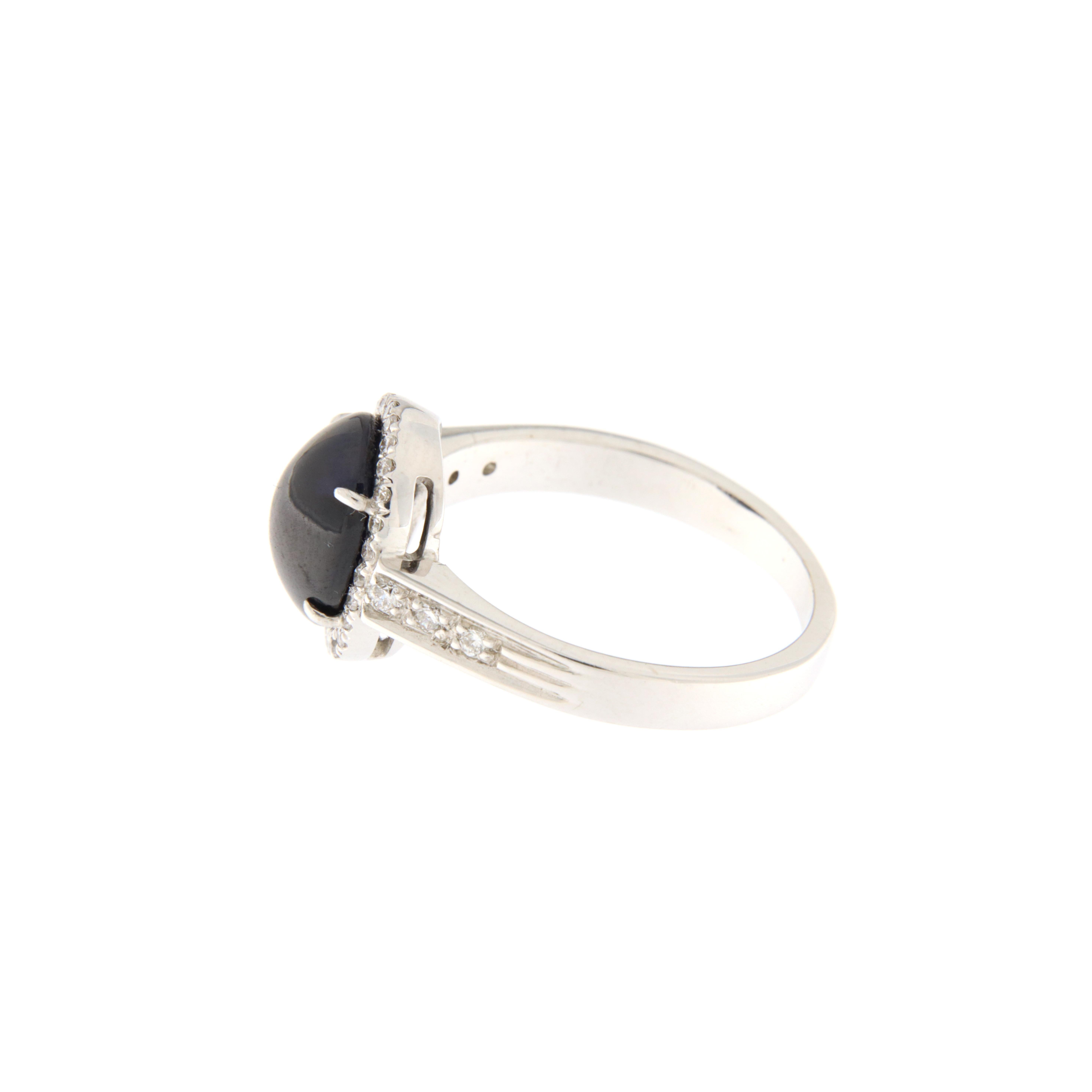 Modern 18 kt. white gold ring with blue sapphire cabochon ct.4.00 and brilliants ct.0.20 For Sale