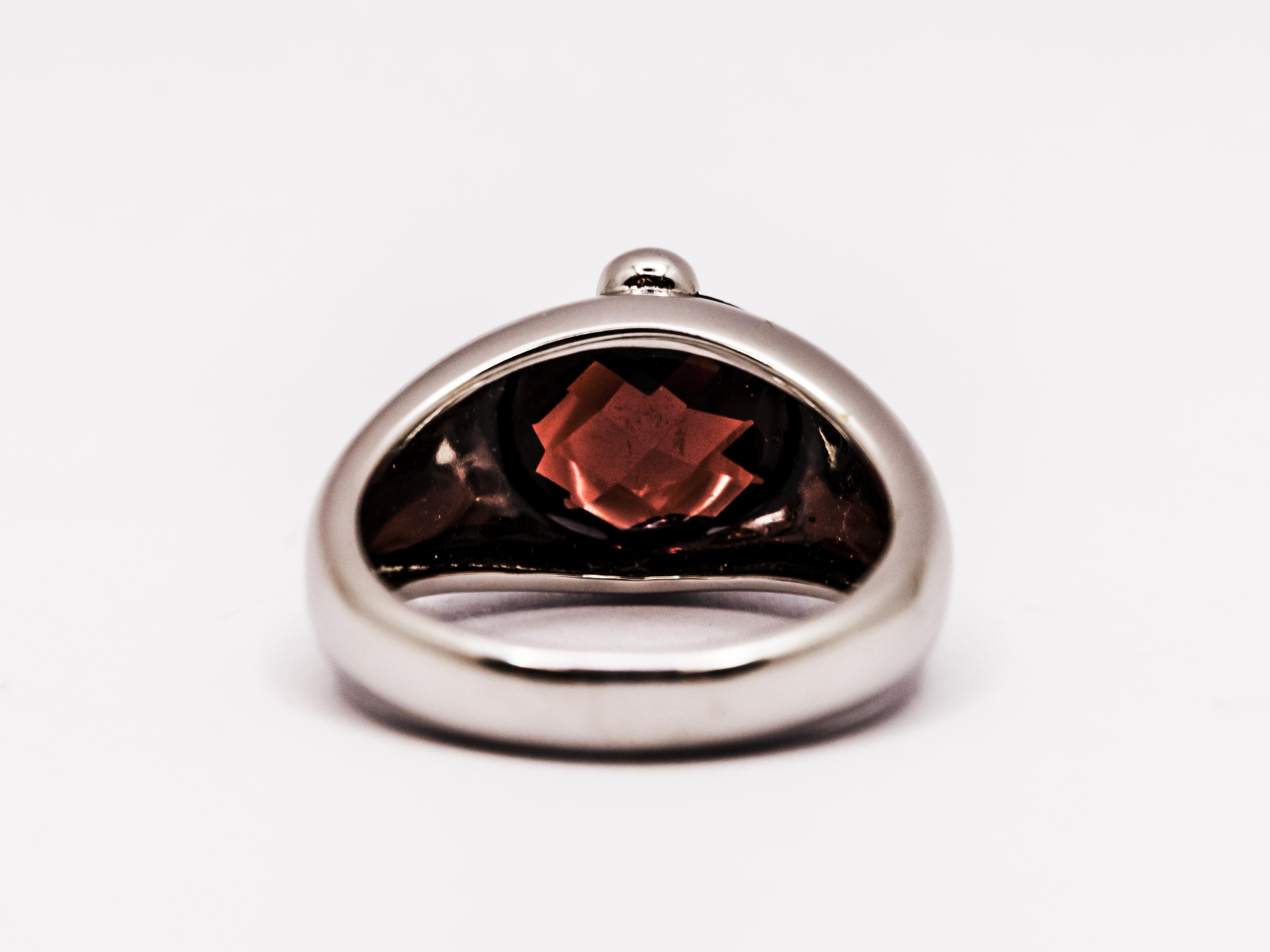 Oval Cut 18 Kt White Gold and Faceted Oval Garnet Ring For Sale