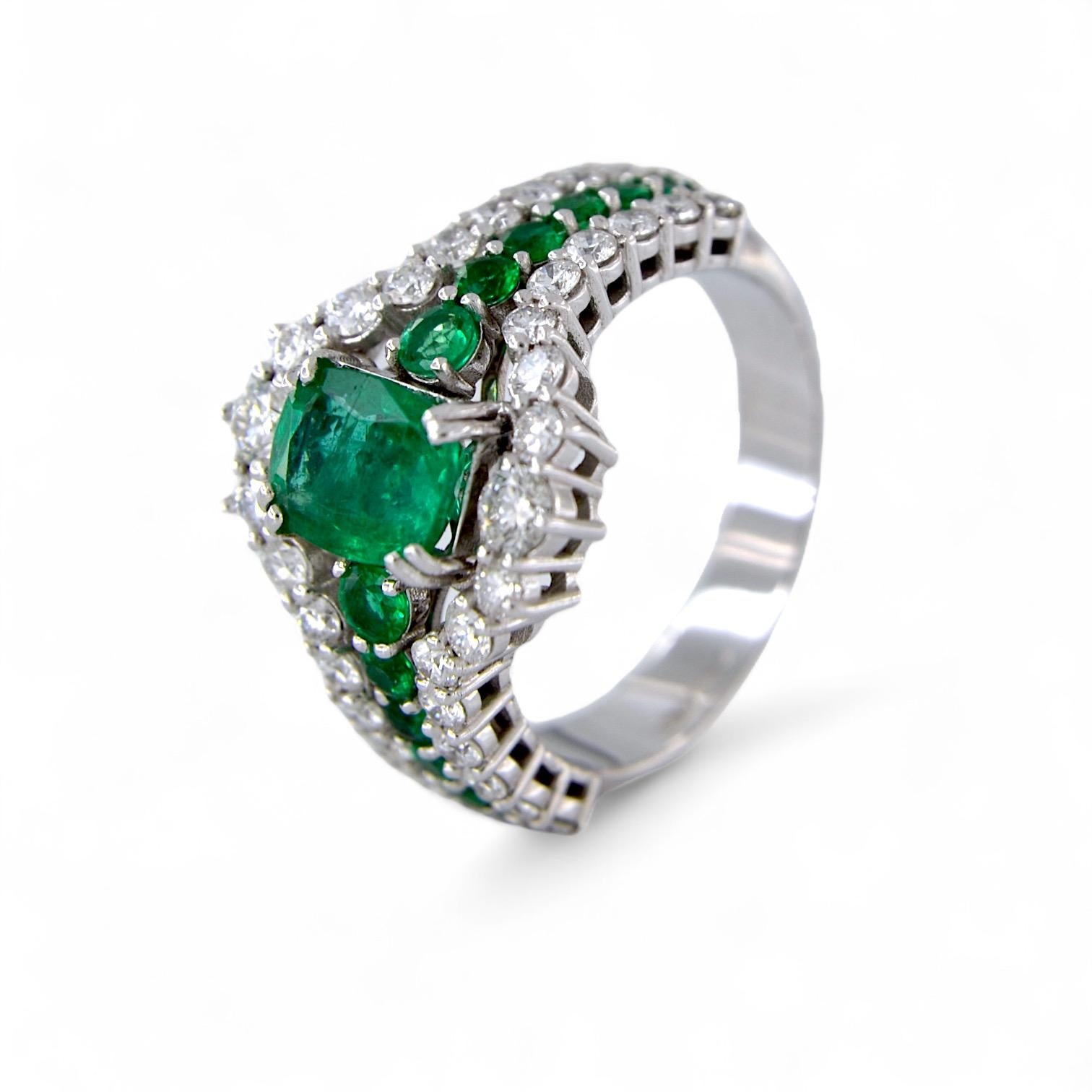 Emerald Cut 18kt white gold ring with 1.53 Ct Emerald, and with Emeralds and Diamonds For Sale