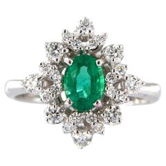18kt White Gold Ring with Oval Emerald and Diamonds