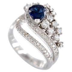 18kt white gold ring with 1.27 ct. blue Sapphire and 0.76 ct. Diamonds.