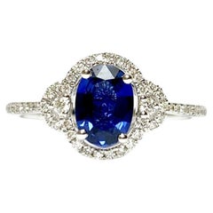 18kt white gold ring 0.23 ct diamonds and 0.94 ct oval blue sapphire