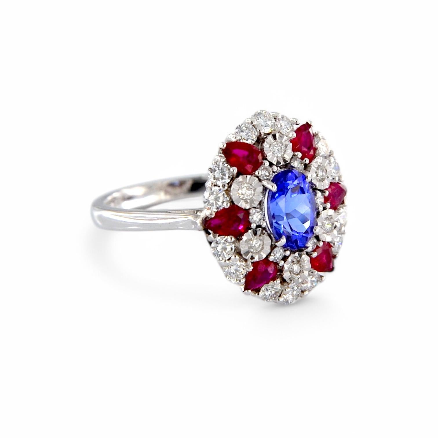 Artisan White gold ring with 1.05 ct oval tanzanite, with rubies and diamonds For Sale