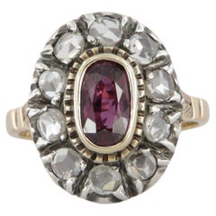 Anillo estilo antiguo en oro y plata con diamantes y un rubí ovalado ct 0.95