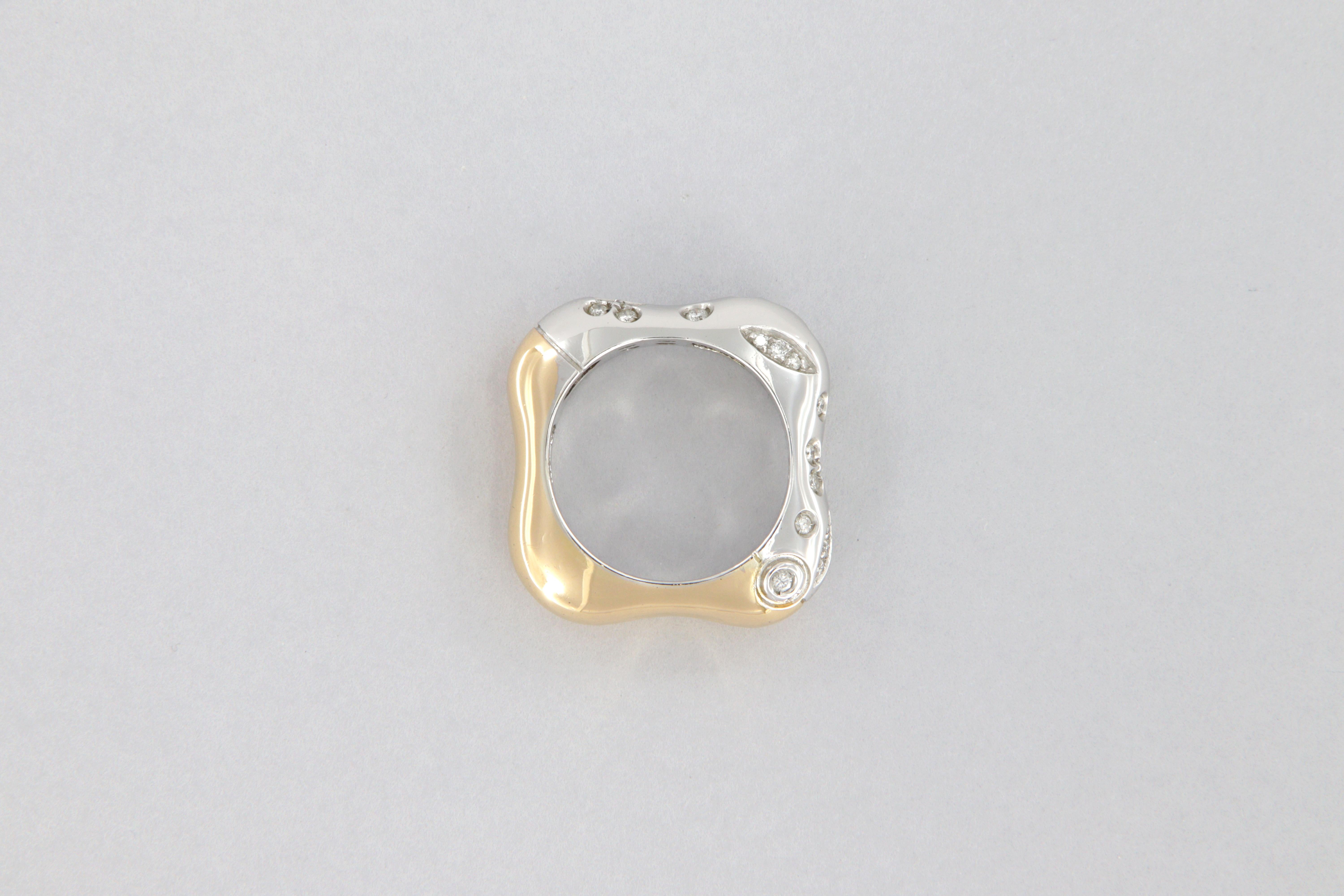 18kt white and light rose gold ring, weight g 9.6 with round brilliant-cut diamonds, weight carat 0.34, clarity VS, color G.

The ring was made by La Nouvelle Bague (Florence) in 1997 and remained in production for about 3 years declined in several
