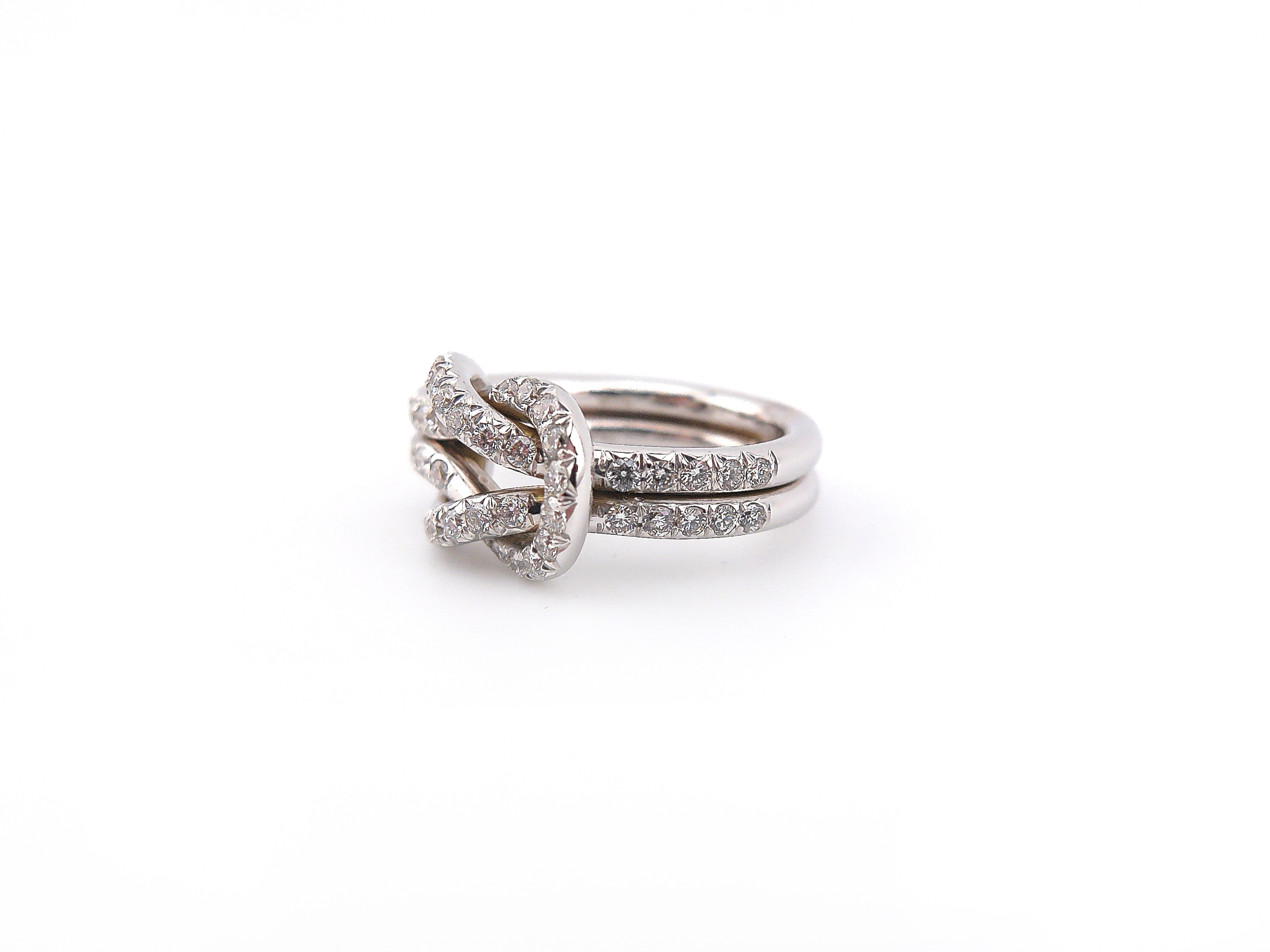Contemporary 9 kt white gold knot ring and brilliants ct. 1.03 For Sale