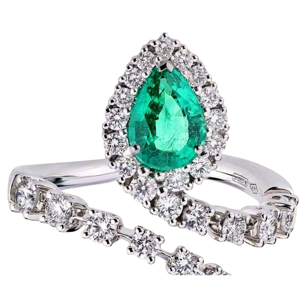 18kt White Gold snake ring with 0.95 emerald and 0.89 diamonds