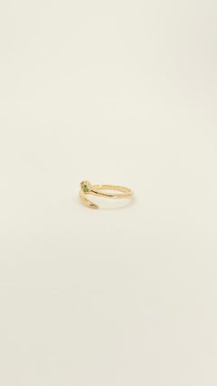 Serpent ring in 14Kt Yellow Gold, Emeralds and Rubies. Artisanal