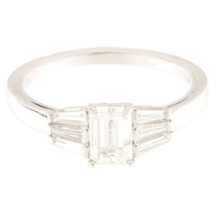 White gold solitaire ring with central emerald-cut diamond ct.0.95