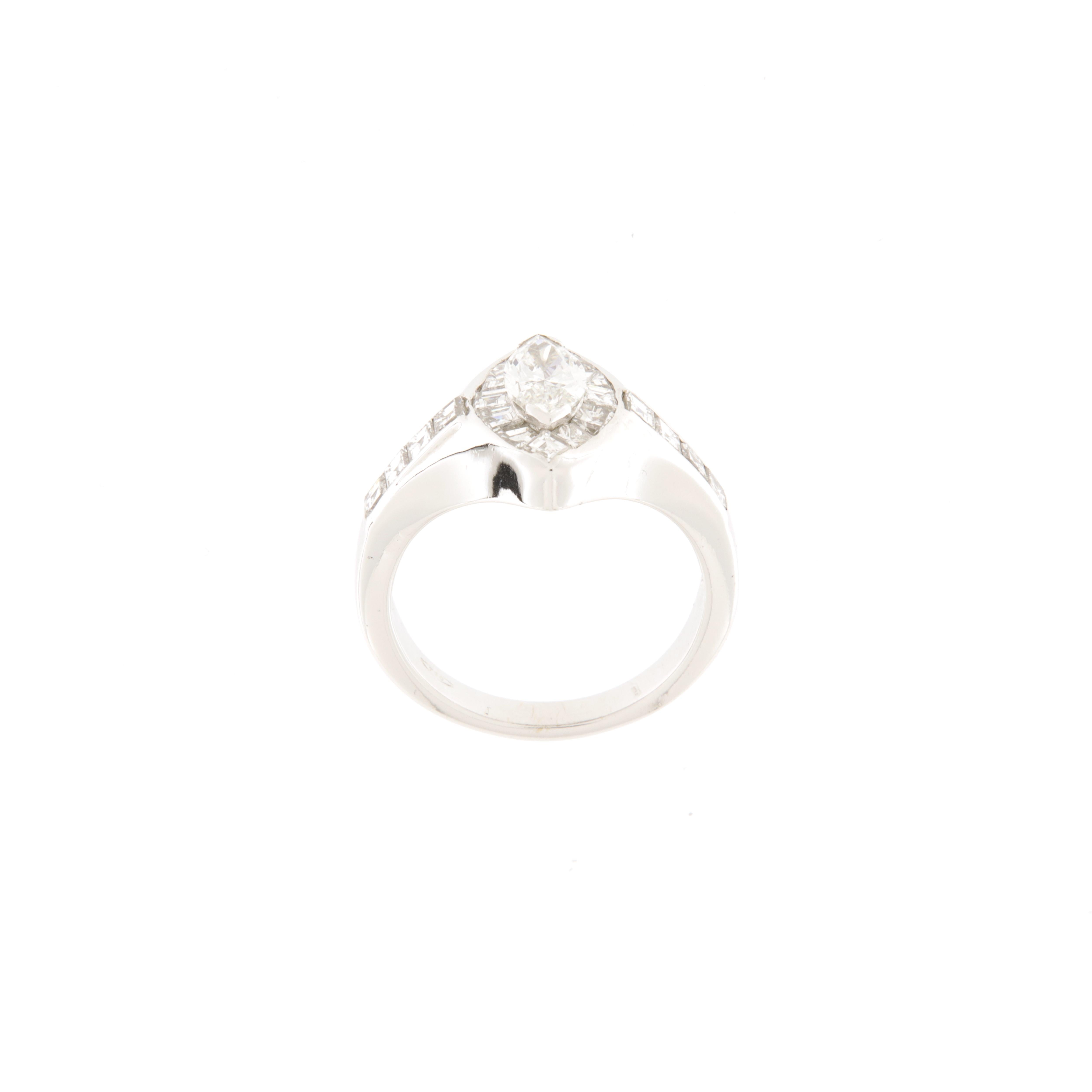 White gold ring with central marquise-cut diamond ct.1.07 and taper and carré-cut contour diamonds ct.0.62.