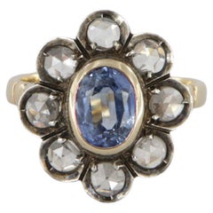 Antique style gold and silver ring with diamonds and oval sapphire carat 1.37