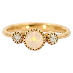 Trilogy ring in 18K Yellow Gold, Noble Opal and Diamonds