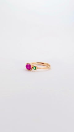 Trilogy ring, 18K Rose Gold, 0.20 Ct Cabochon Ruby and Emeralds. Contemporary