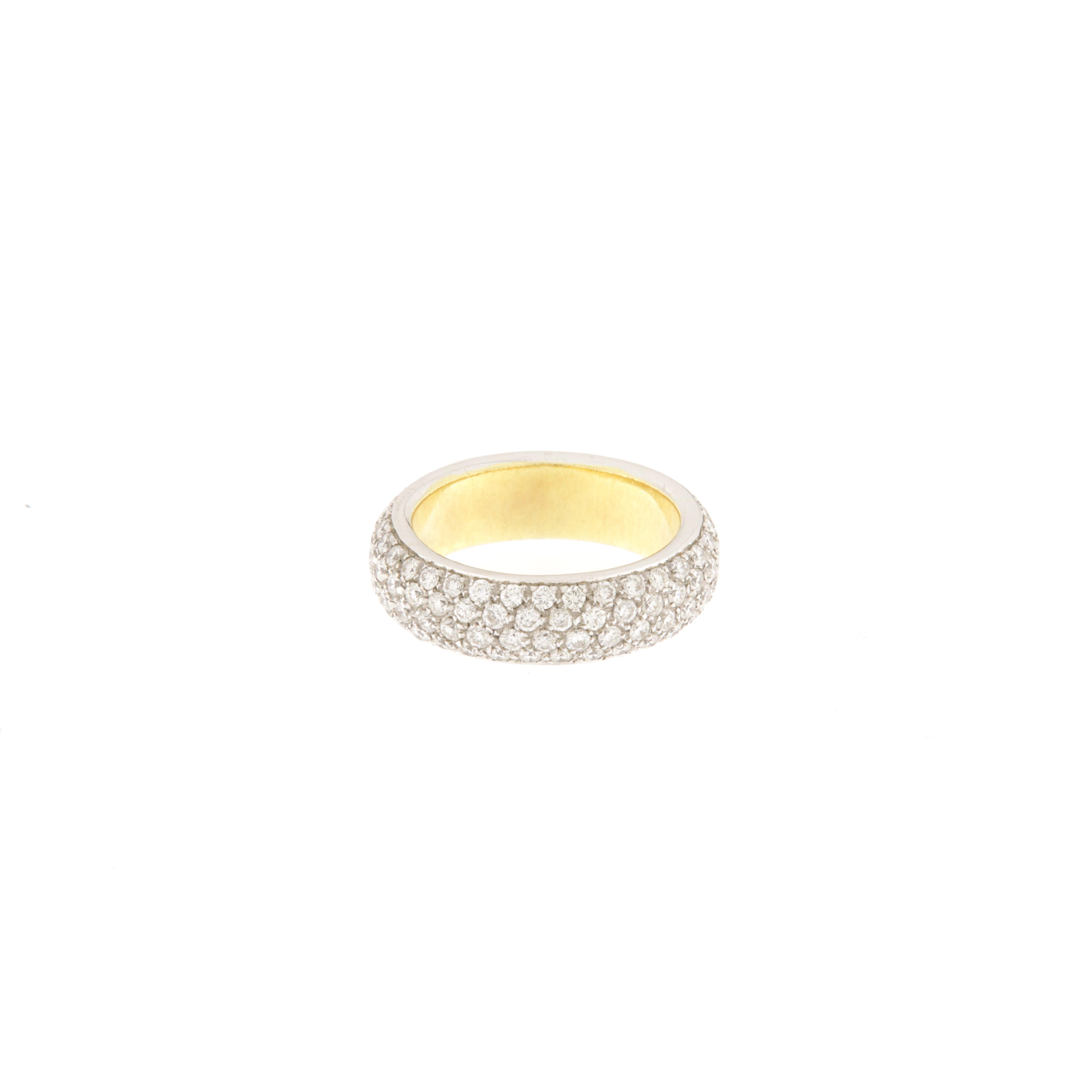 Full circle yellow gold veretta ring with pavé diamonds on white gold. The surface of the ring is not flat but slightly convex. The brilliant-cut diamonds are pavé-set for a total of ct.2.26. This ring can also be worn in combination with a gold