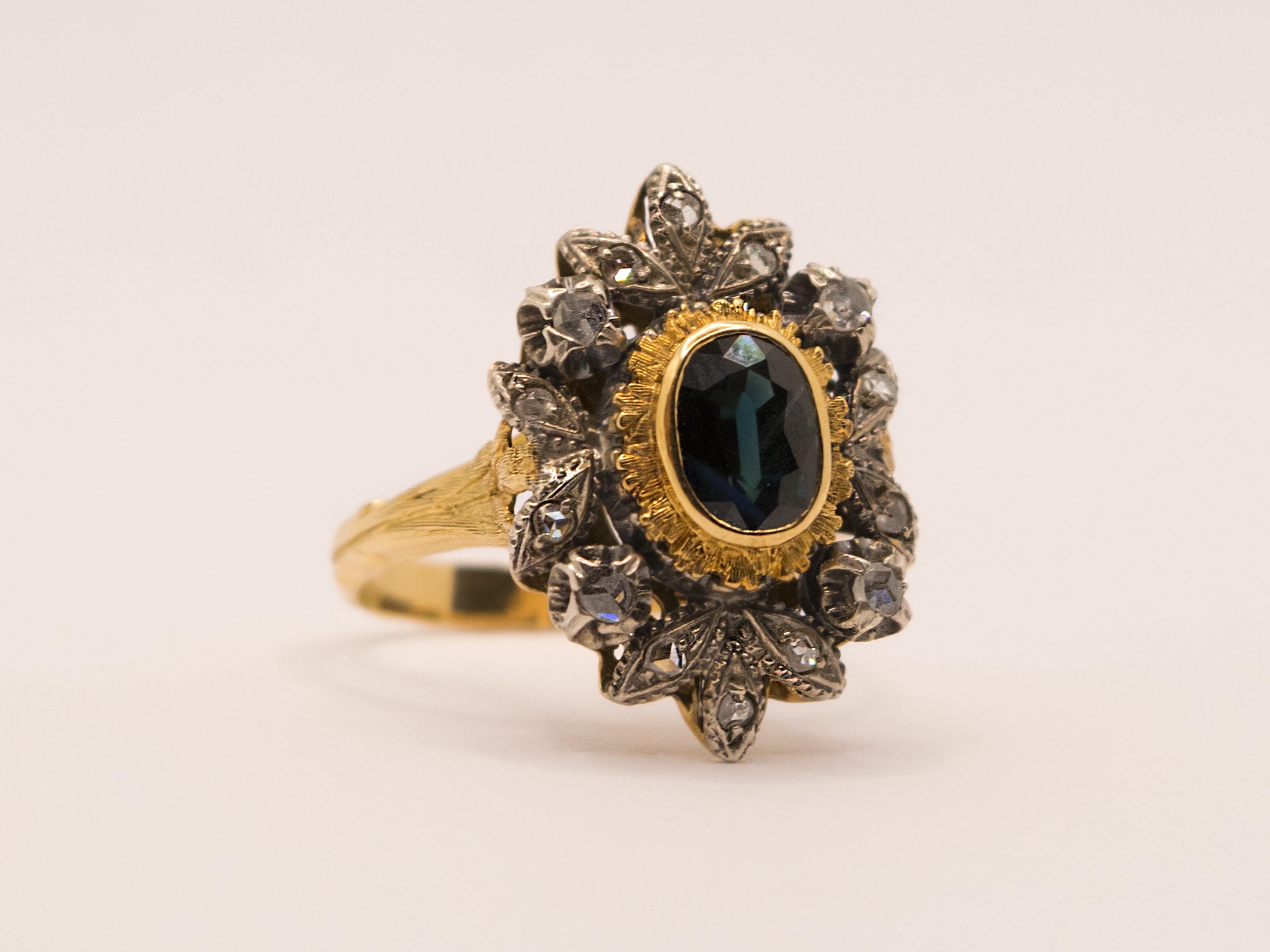 Oval Cut Vintage 1940s Yellow Gold and Silver Ring with Sapphire and Diamonds For Sale