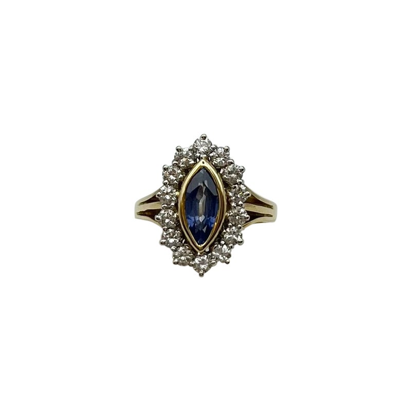 Handcrafted vintage ring with blue sapphire and diamonds in 18 kt yellow gold.