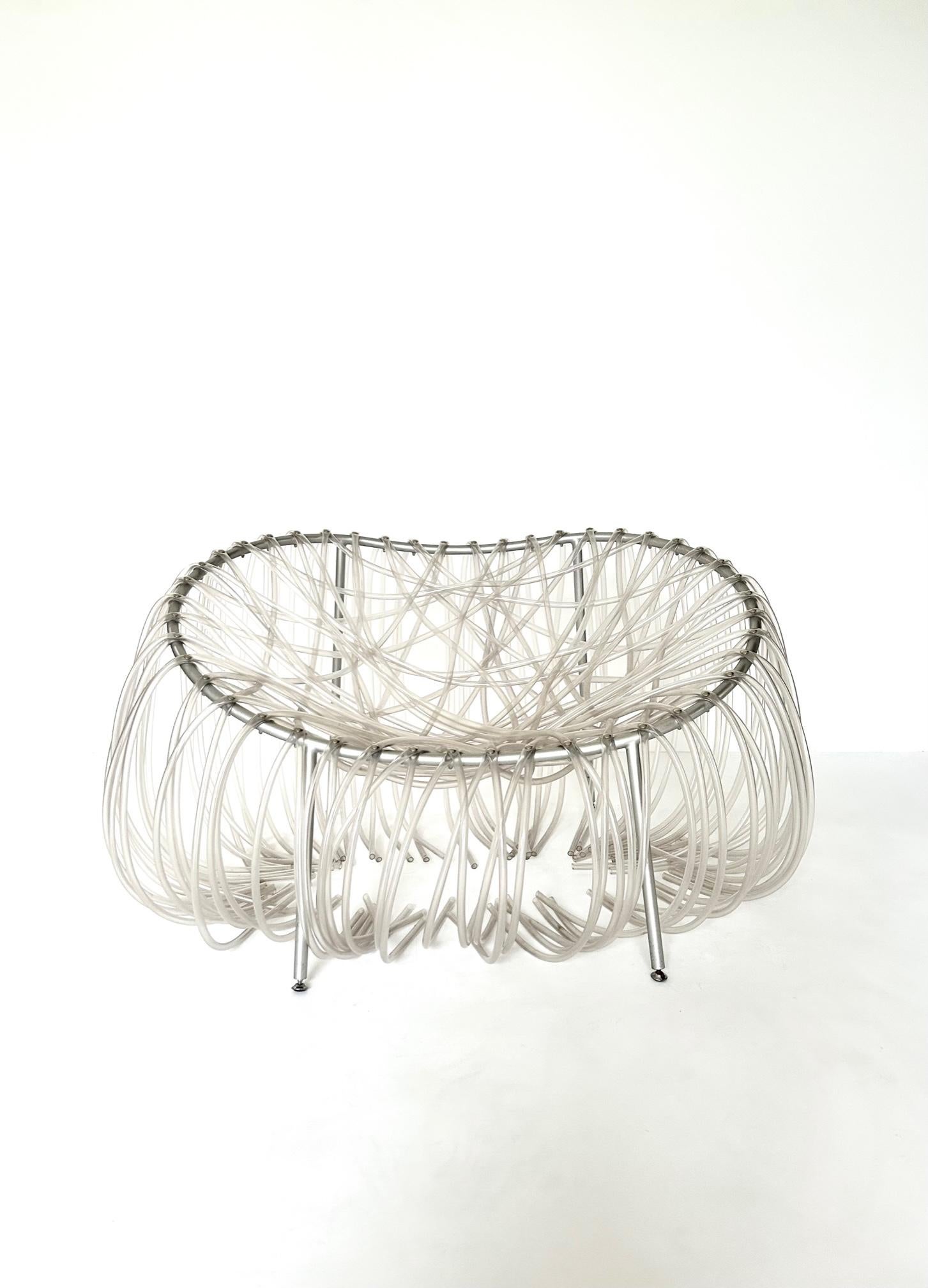 Fernando and Humberto Campana Anemone chair manufactured by Edra. Brazil/Italy, 2001. Special hollow tubes in plastic are handwoven methodically and screw-attached to the corolla-shaped frame in moulded metal, sanded and coated a metallic grey