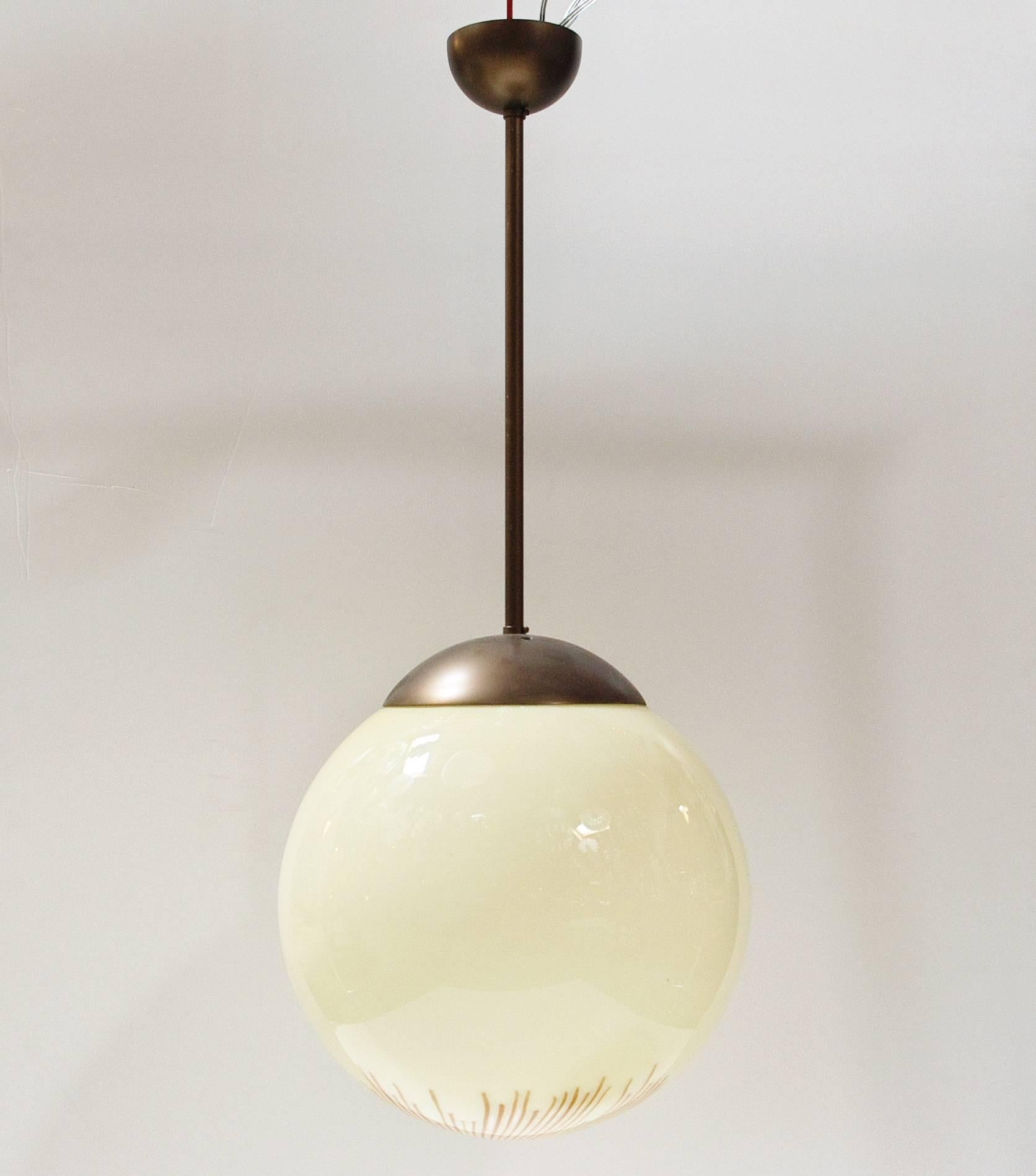 Italian Murano Anemone glass globe pendant with bronzed metal hardware / Designed by Ludovico Diaz de Santillana for Venini circa 1960s / Made in Italy
1 light / E26 or E27 type / max 60W
Measures: Diameter: 14 inches / height 34 inches including