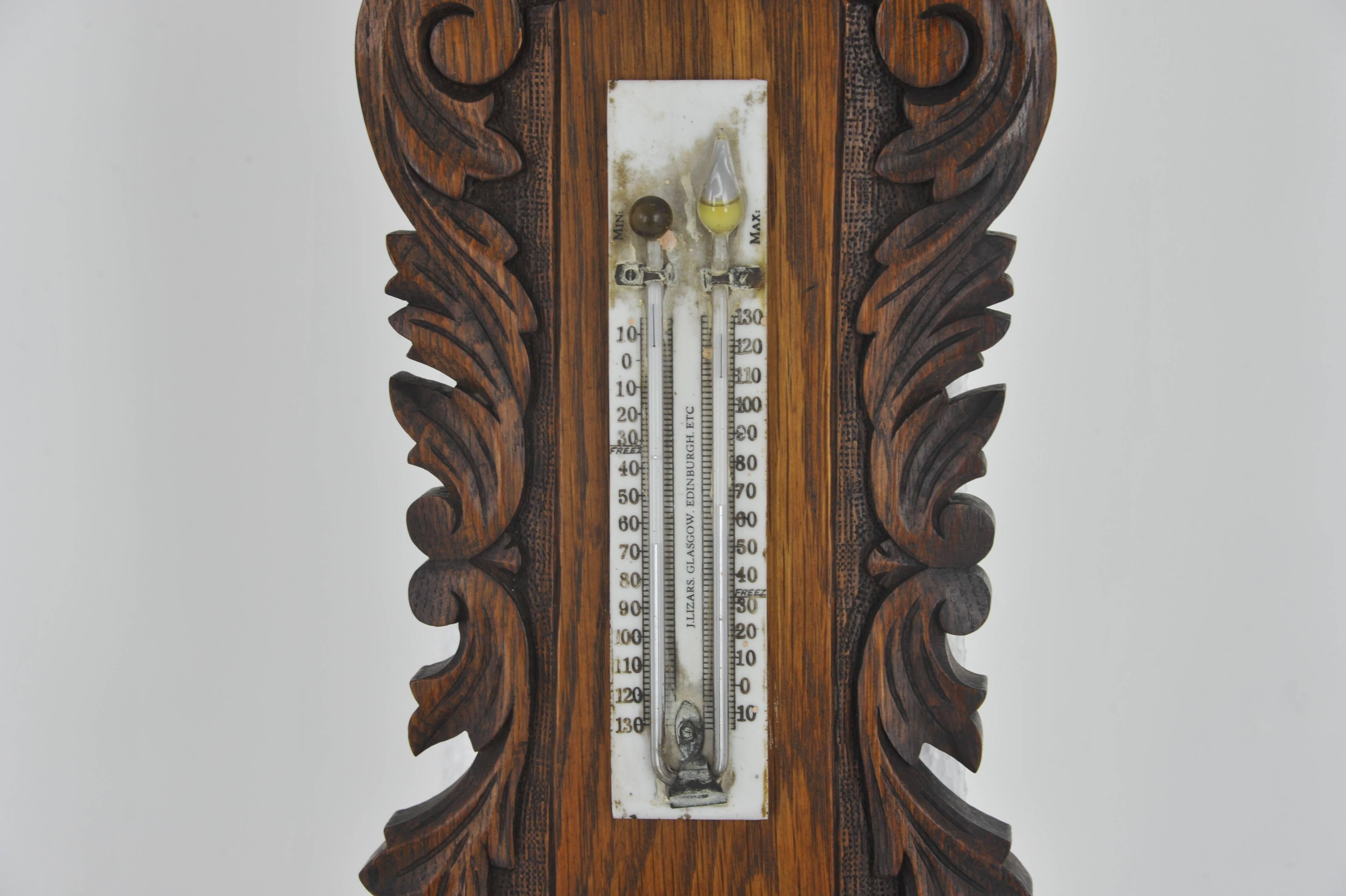 Aneroid barometer, decorative barometer, carved oak barometer, Scotland 1890, Antique Furniture, H25

Scotland, 1890.
Solid oak with original finish
Profusely carved top
Double thermometer below
Porcelain dial with visible works
Signed on porcelain