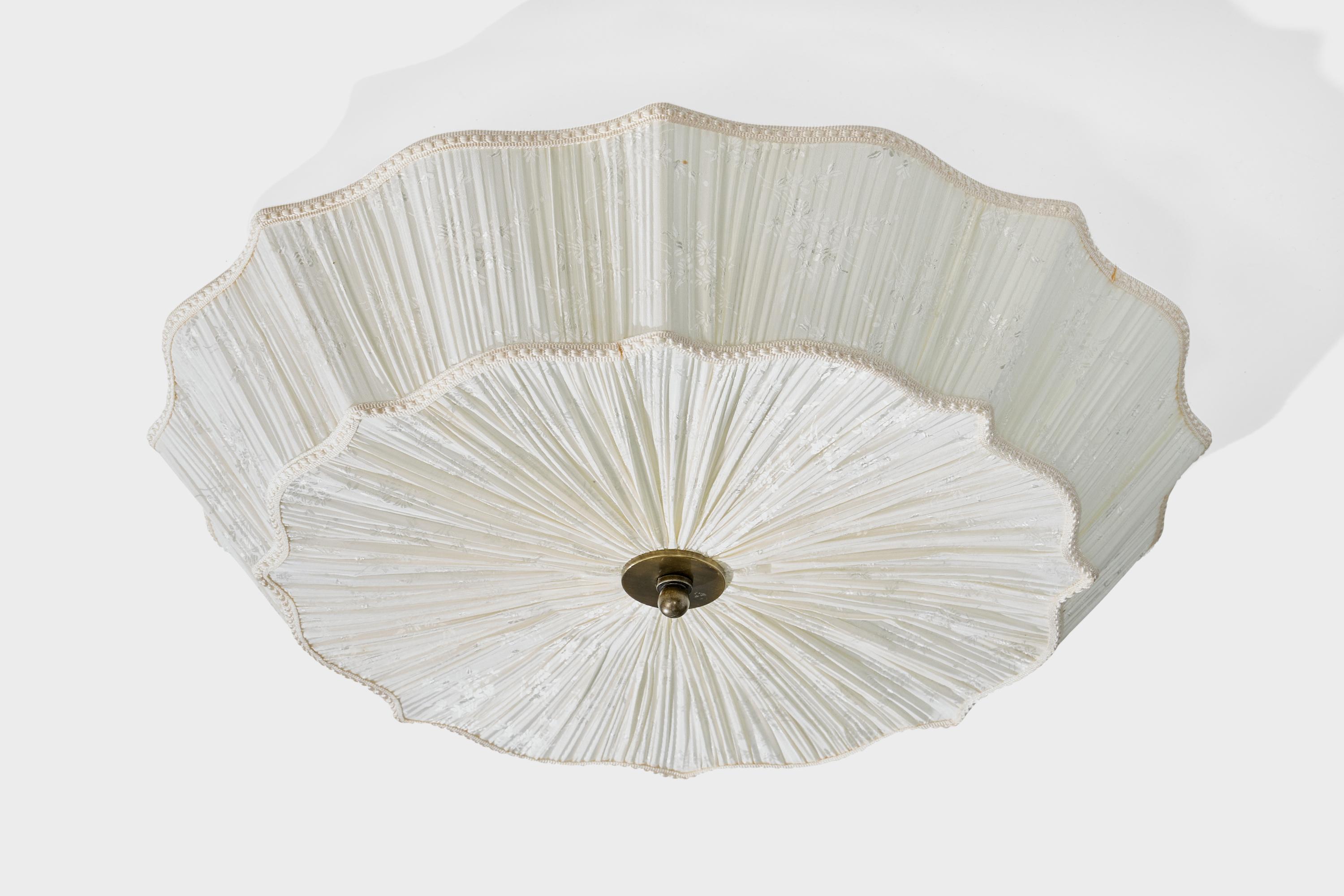 A white fabric and brass flush mount produced by Aneta, Sweden, c. 1990s.

Overall Dimensions (inches): 6.75