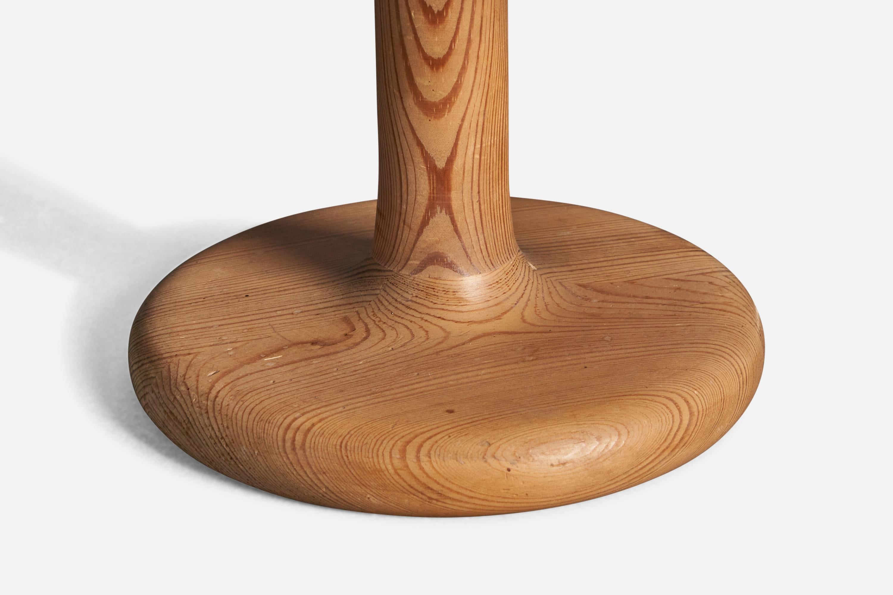 A table lamp designed and produced by Aneta. In solid pine. With makers label.

Condition: Good 
Wear consistent with age and use.

Dimensions of Lamp (inches): 12” H x 7.75” Diameter

Dimensions of Shade (inches): 6.5” Top Diameter x 14.15” Bottom
