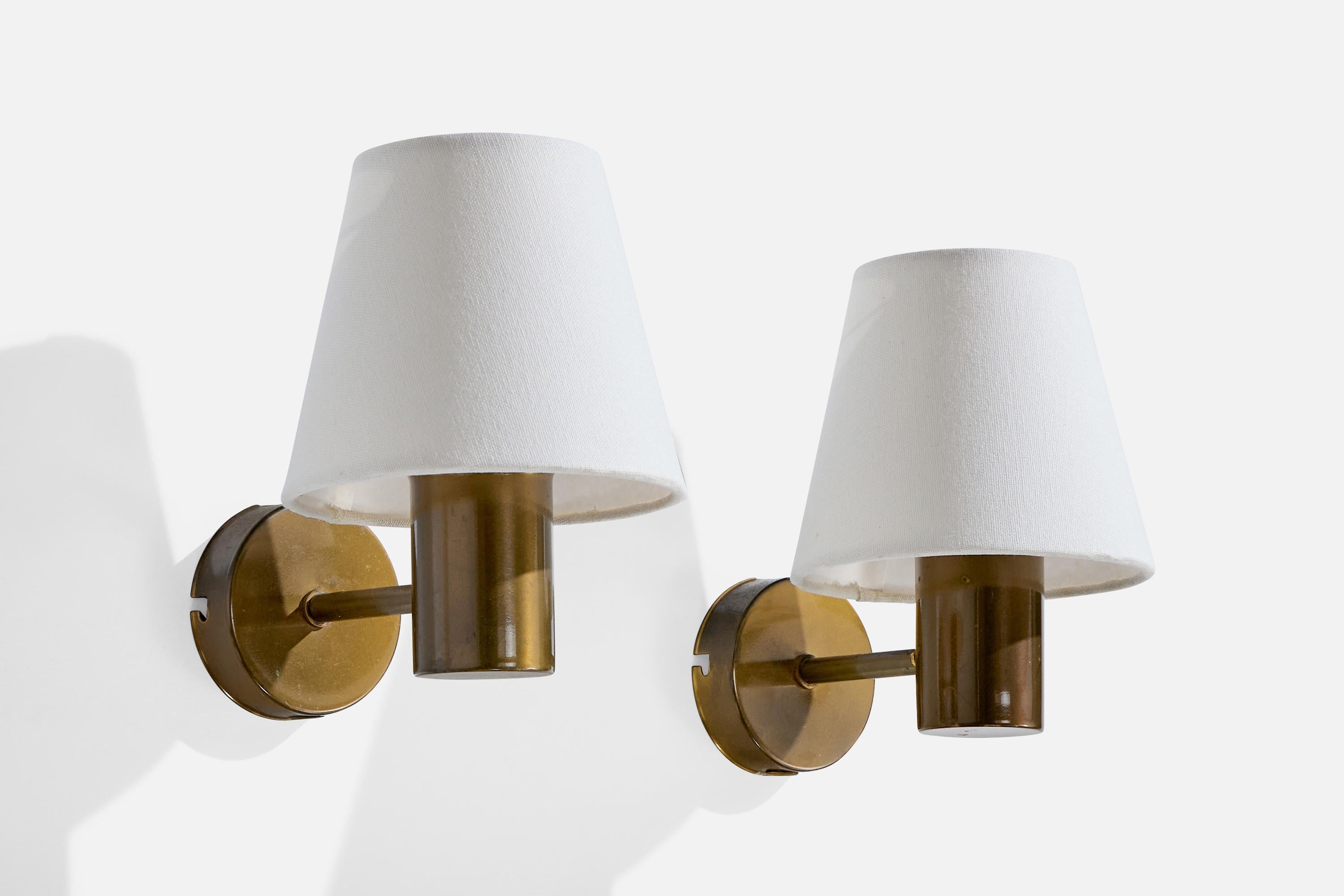 A pair of brass and white fabric wall lights designed and produced by ANF, Sweden, c. 1960s.

Very light oxidation present throughout brass.

Overall Dimensions (Inches): 6.9” H x 5.1” W x 7.375“ D

Back Plate Dimensions (Inches): 2.9” H x 2.9“ W x