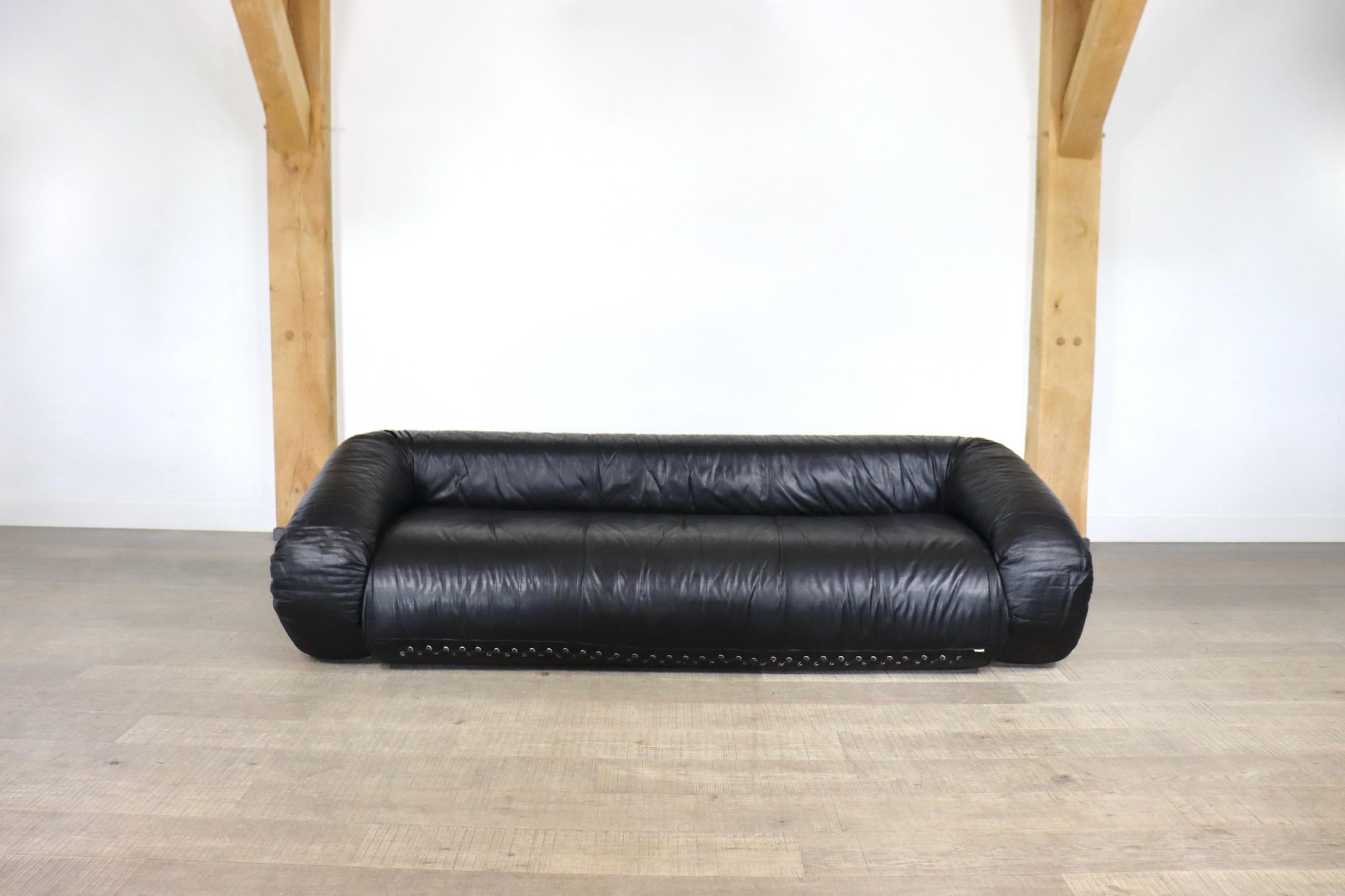 Incredible Anfibio sofa bed by Alessandro Becchi for Giovanetti Collezione Italy 1971. This stunning original black leather upholstery fits perfectly with the white teddy fabric on the mattress inside. The sofa can easily be converted into a bed, or