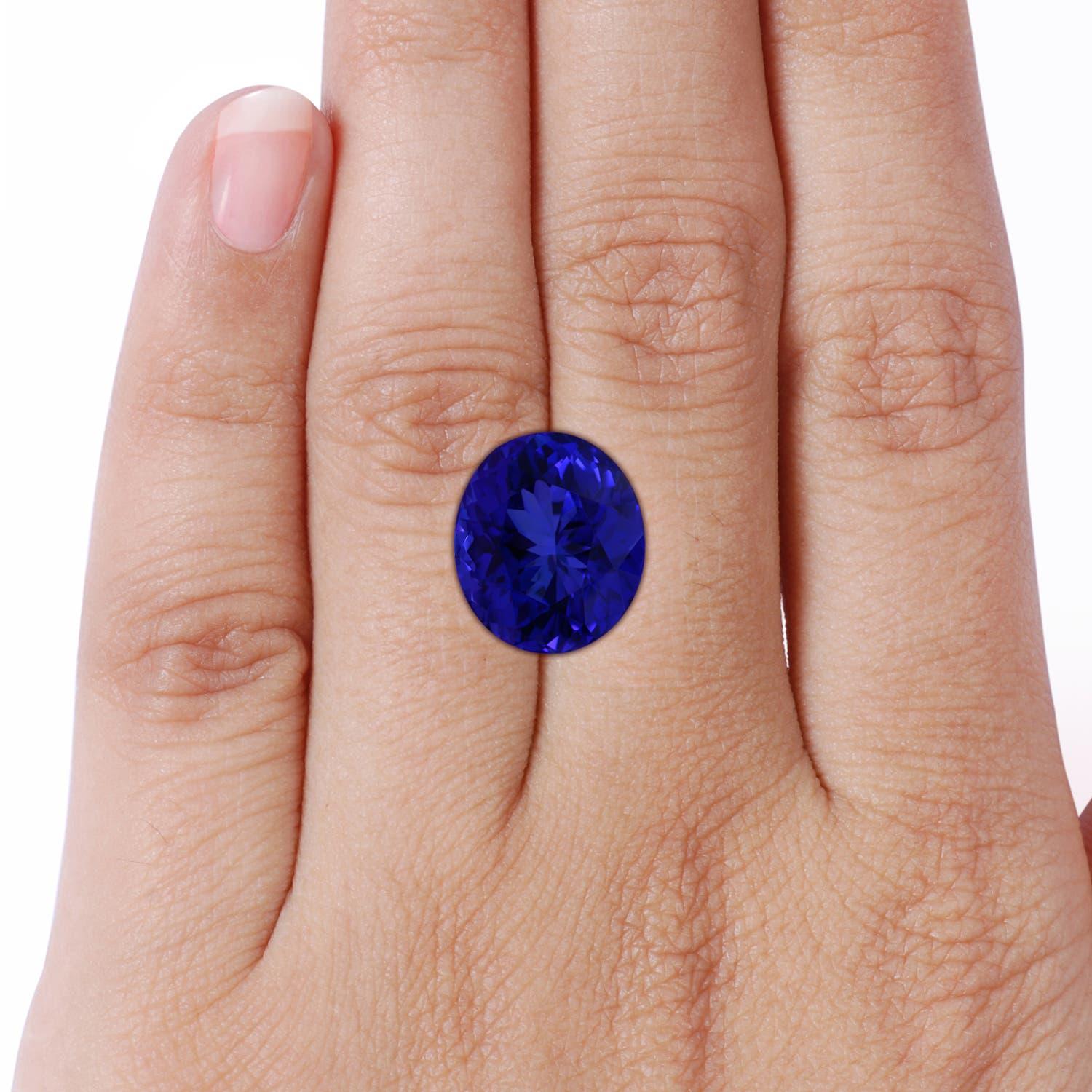 For Sale:  ANGARA Classic GIA Certified Tanzanite Three Stone Yellow Gold Ring with Diamond 7