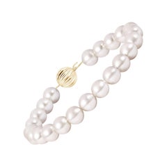 Angara Pulsera clásica de una sola vuelta de perlas cultivadas de los mares del sur en oro macizo de 14 quilates