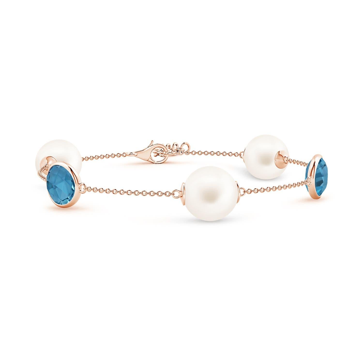 De las mujeres Pulsera Angara de perlas cultivadas de agua dulce y topacio azul de Londres ovalado en oro de 14 quilates en venta
