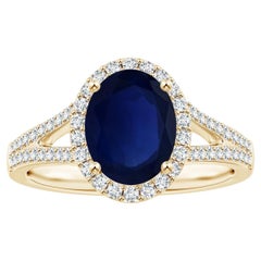 Anello con zaffiro blu naturale certificato GIA in oro giallo 14K e diamante aureolato