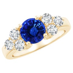 Angara Gia Gelbgoldring mit zertifiziertem natürlichem blauem Saphir und drei Diamanten