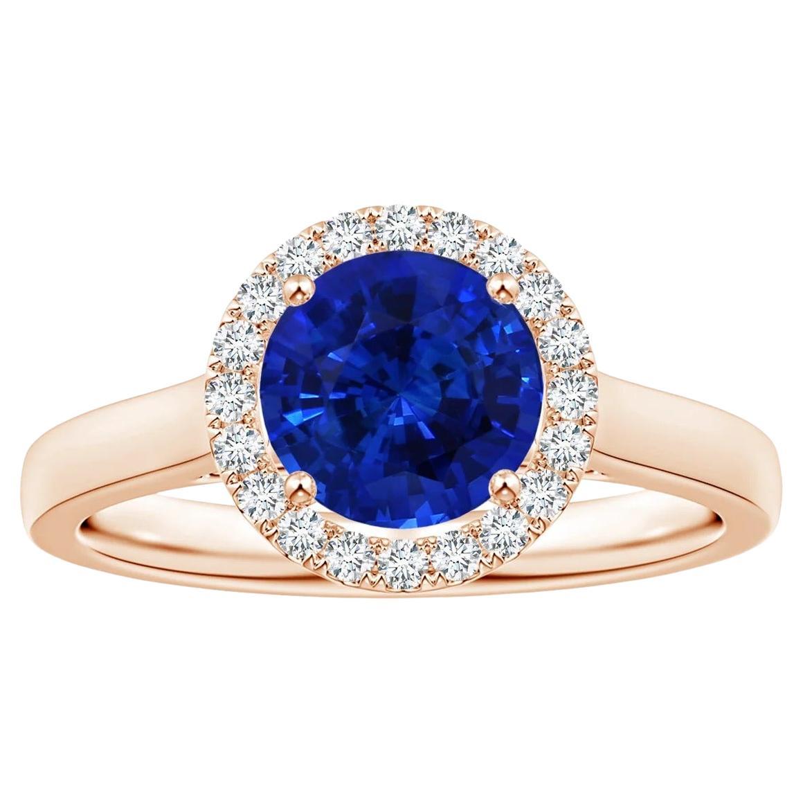 Angara Gia Bague en or rose avec saphir bleu rond certifié naturel et halo