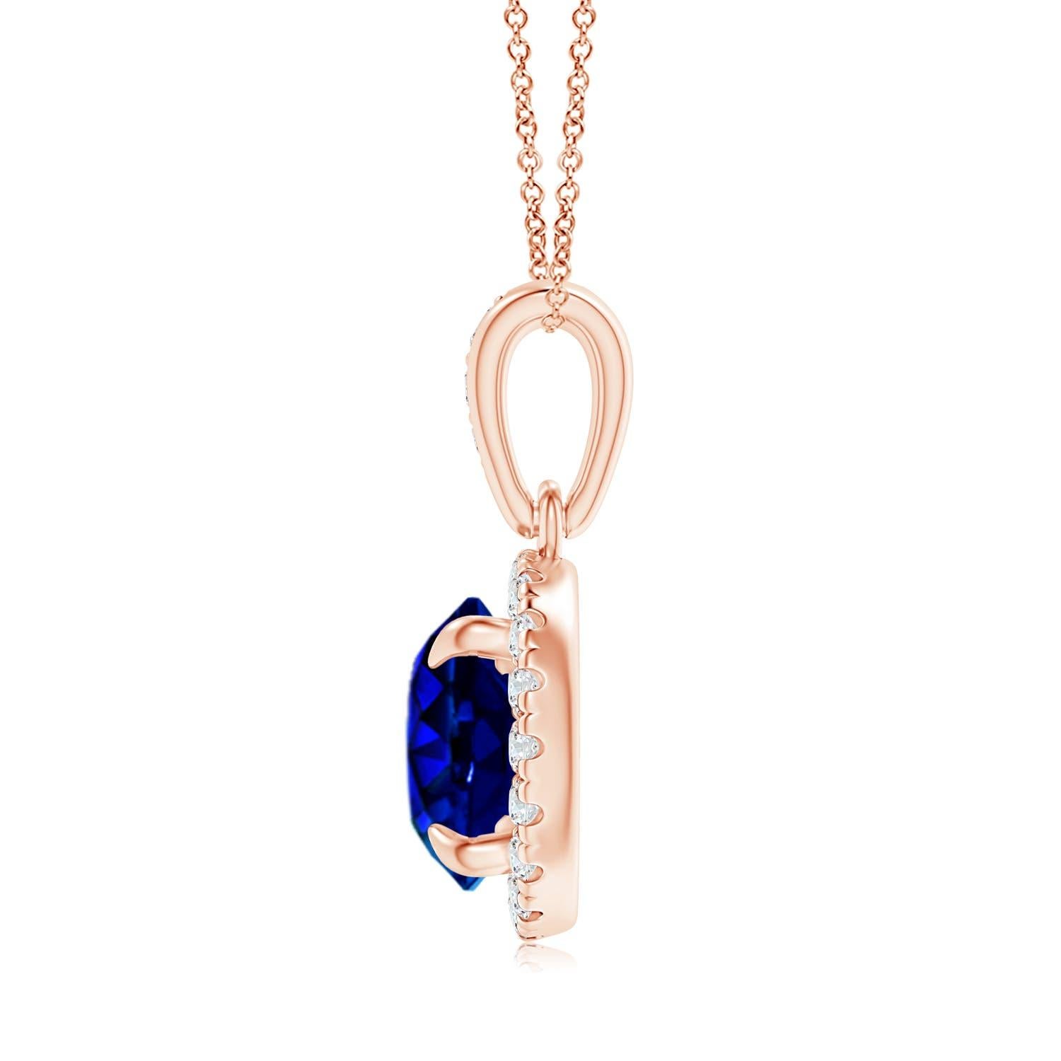 This stunning pendant showcases a GIA certified sapphire, secured in a claw setting. Glittering round diamonds encircle this round blue gemstone in a brilliant halo and illuminate its mesmerizing hue. Additional diamonds adorn the bale and