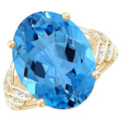 Bague en or jaune avec diamants et topaze bleue naturelle suisse certifie par le GIA