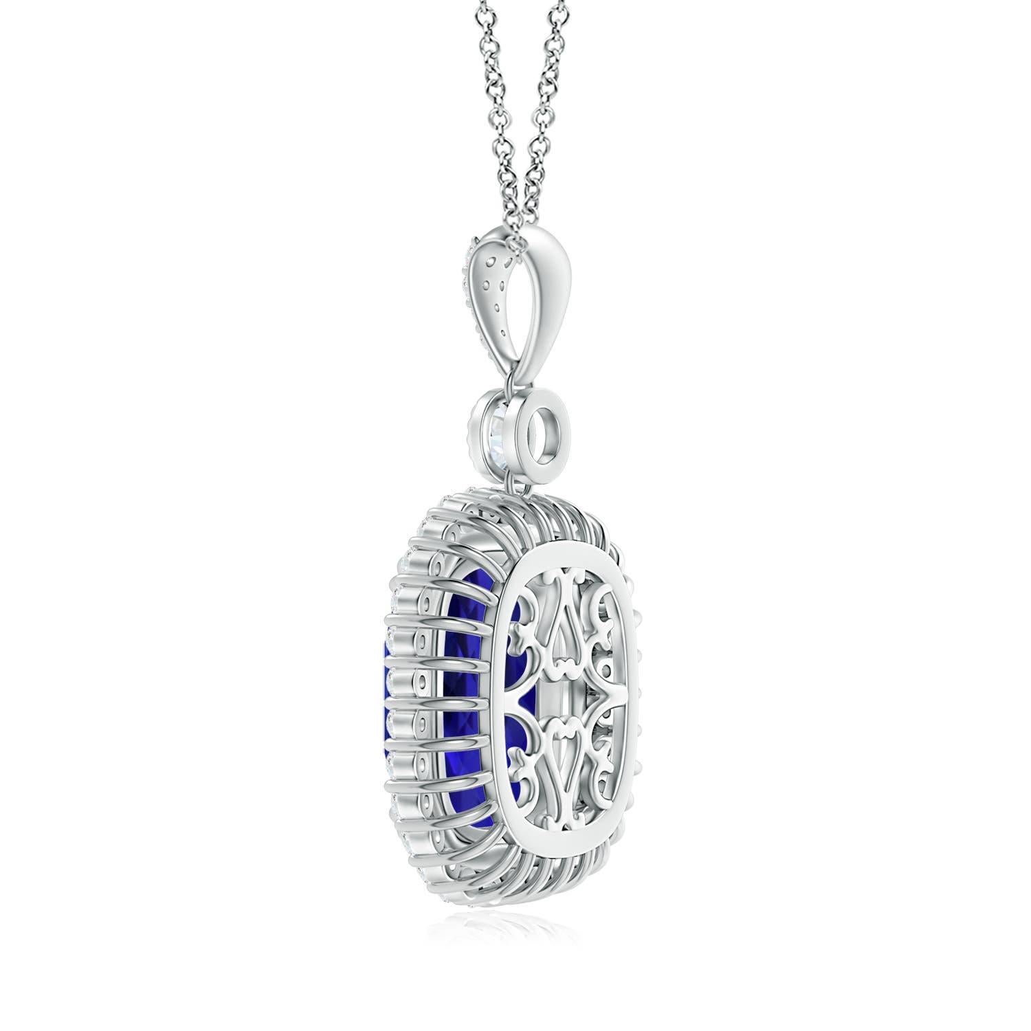 Glowing in the center of a double halo of diamonds, the GIA certified cushion tanzanite draws attention to its striking bluish-violet hue. A bezel-set round station diamond links the double claw-set tanzanite to a diamond studded bale. Inspired by