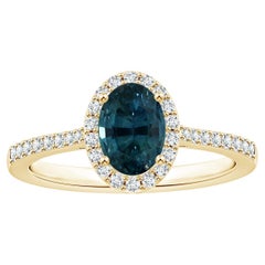 ANGARA Anello con zaffiro naturale di colore verde acqua certificato GIA in oro giallo con aureola